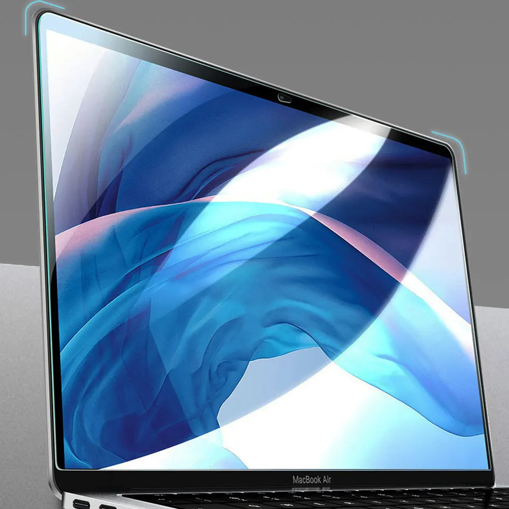 A close-up view of a MacBook Air displaying a vibrant blue and white abstract background with a clear screen protector applie