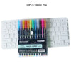 A set of 12 glitter pens in various colors displayed next to a laptop keyboard.