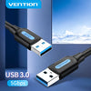 A black USB 3.0 male to male extension cable is shown against a blue background with a mountain landscape visible in the refl