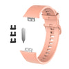 Pinkes Silikon-Armband für ein Fitness-Tracker, mit abnehmbarem Verschluss und Riemen.