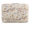 A beige canvas laptop sleeve featuring a delicate floral and bird pattern.