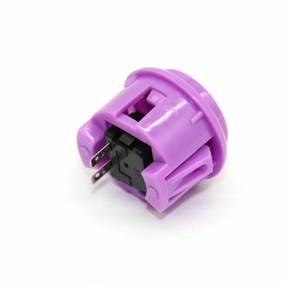A purple arcade push button game switch with a black electrical connector.