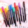 A collection of twelve glitter gel pens in various bright colors including pink, yellow, blue, and orange