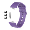 Lila Silikonarmband für einen Fitness-Tracker, gezeigt mit verschiedenen Komponenten.
