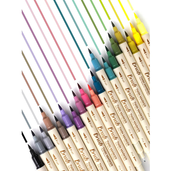 A collection of 12 fine-tipped brush twin markers in various pastel and bright colors arranged diagonally.