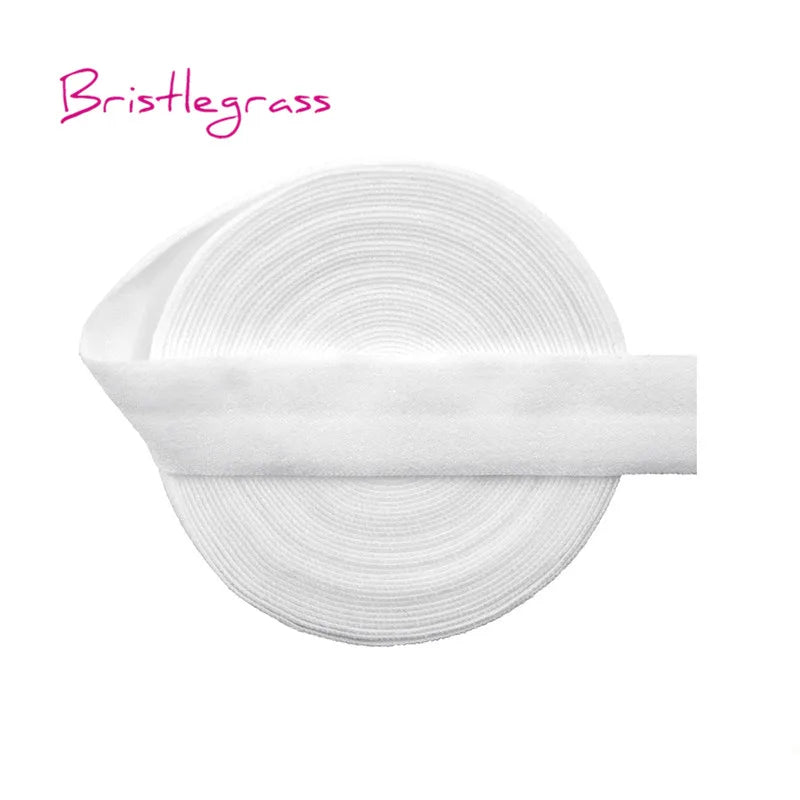 A roll of white Bristlegrass elastic hair ties and trims.