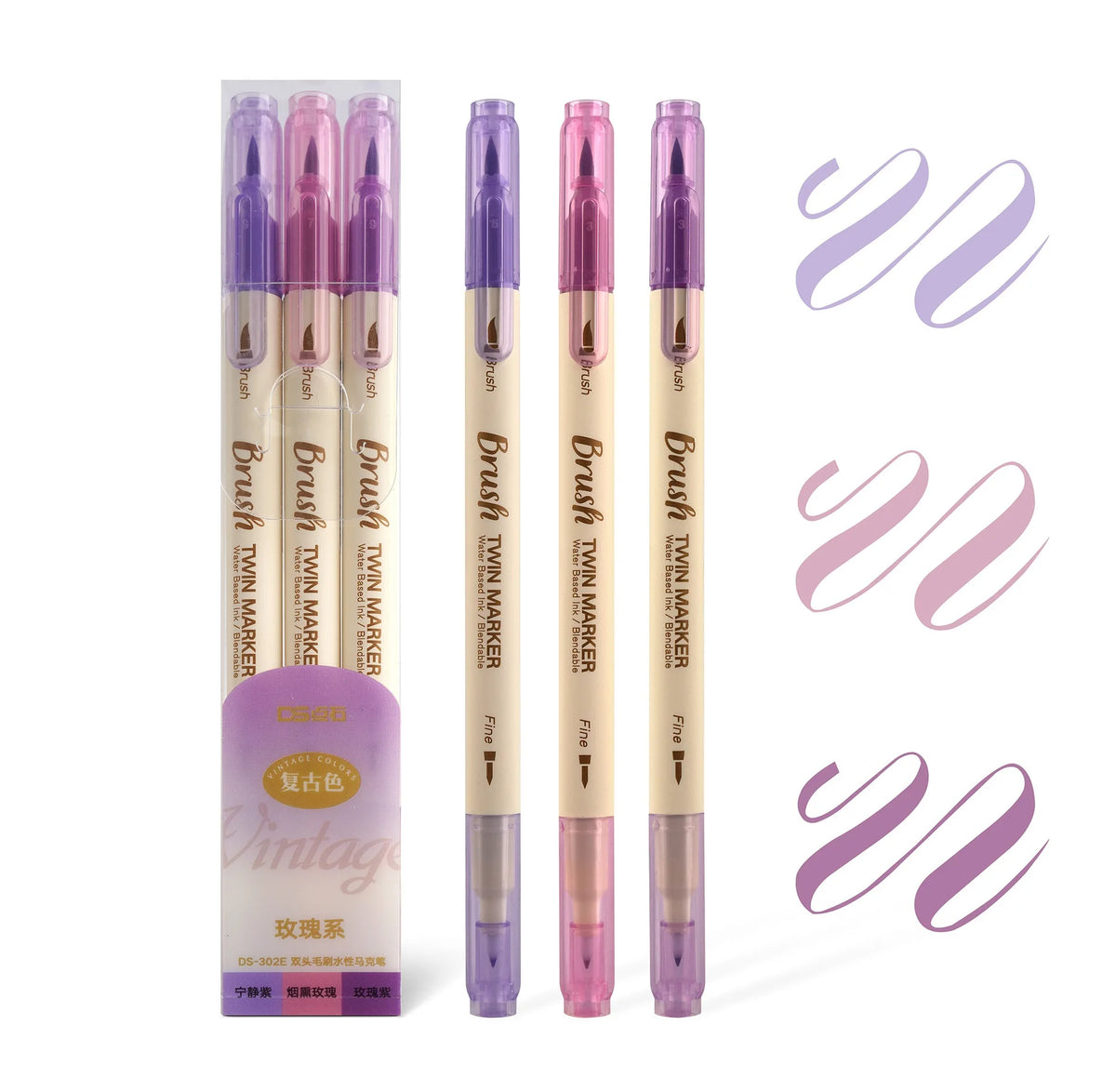 A set of three purple and pink twin markers for watercolor art displayed in packaging and individual tubes.