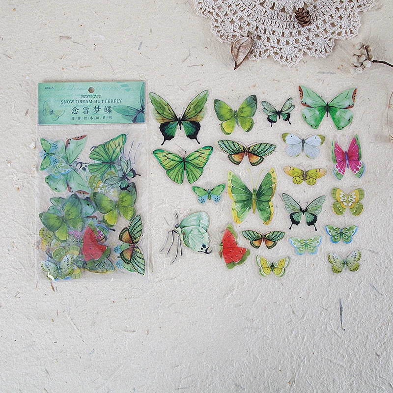 A collection of colorful butterfly wings in a clear plastic sheet for scrapbooking and journaling