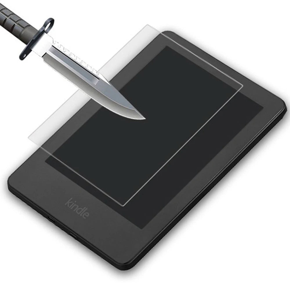 A knife is shown piercing a clear screen protector on a black Kindle e-reader.