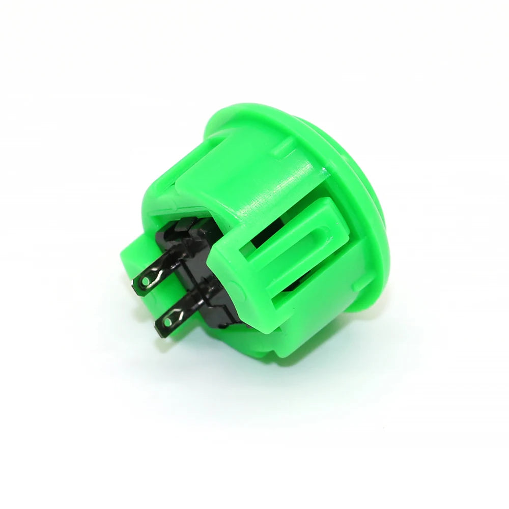A bright green arcade push button game switch with a black connector.