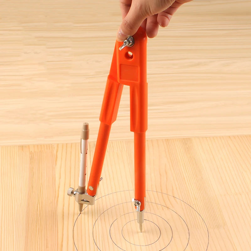 An orange adjustable woodworking marking compass is shown being used to draw concentric circles on a wooden surface.