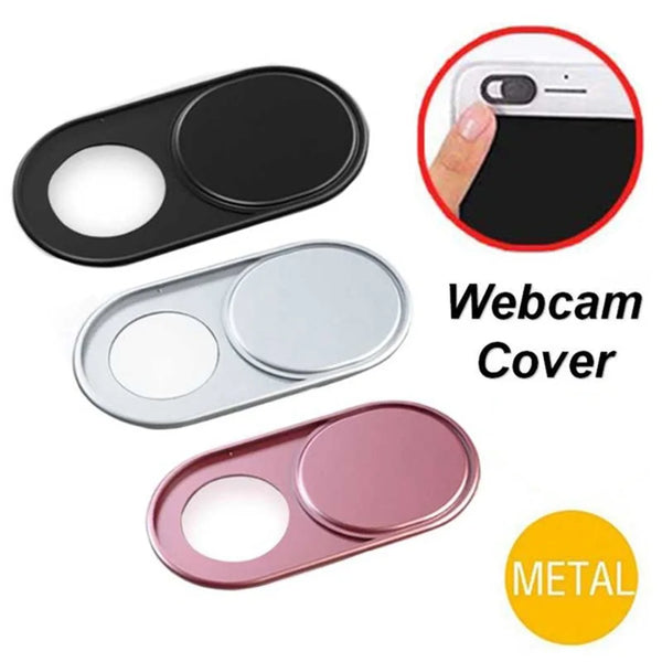 A set of metal webcam covers in black, silver, and pink for digital privacy protection.
