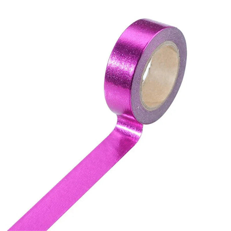 Roll of vibrant pink glitter decorative gold foil washi tape for crafting and journaling