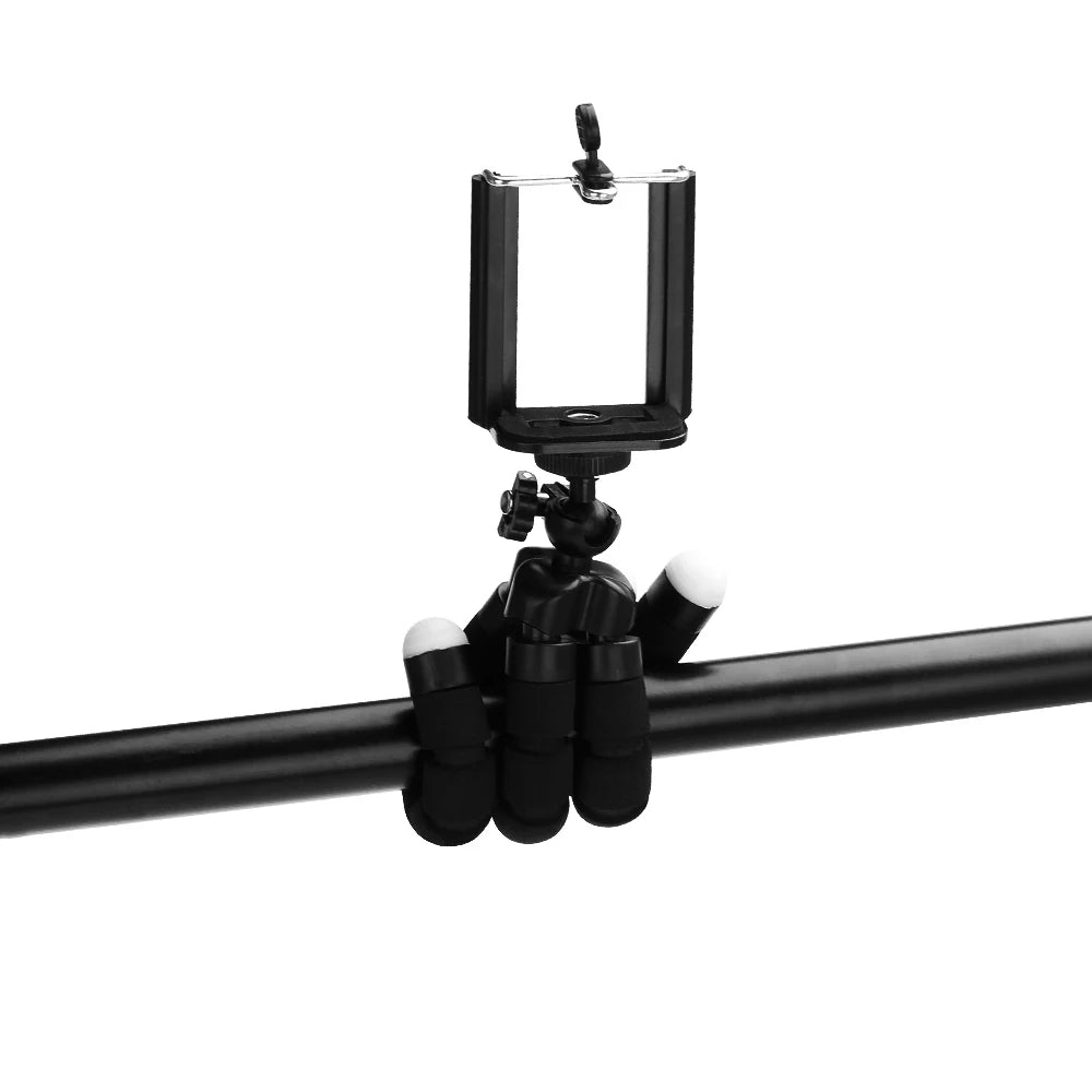 Black flexible mini tripod with a clip for mounting smartphones and cameras.