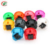 A collection of colorful arcade push button game switches in various colors including green, orange, pink, yellow, black, blu