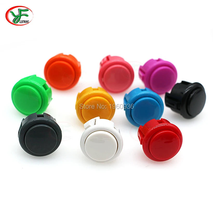 A collection of colorful arcade push button game switches in various colors including orange, pink, purple, green, yellow, bl