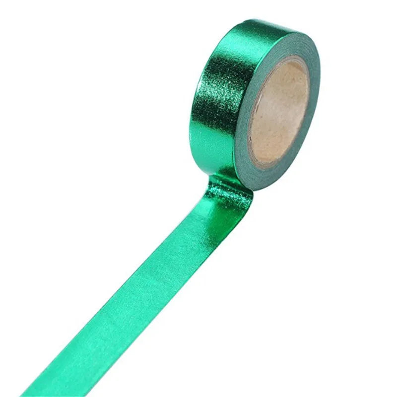 Roll of green decorative foil washi tape for journaling and crafts