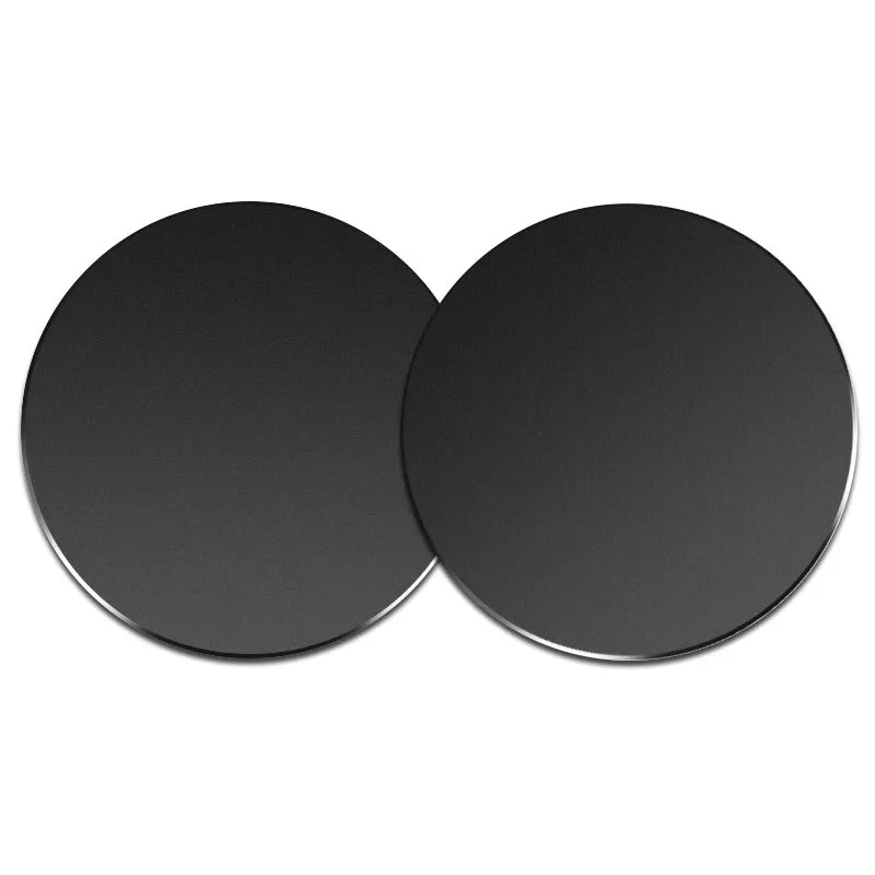 Two round, black magnetic mount plates for phones and devices.
