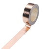 Roll of decorative gold foil washi tape with a silver backing and a tan center.