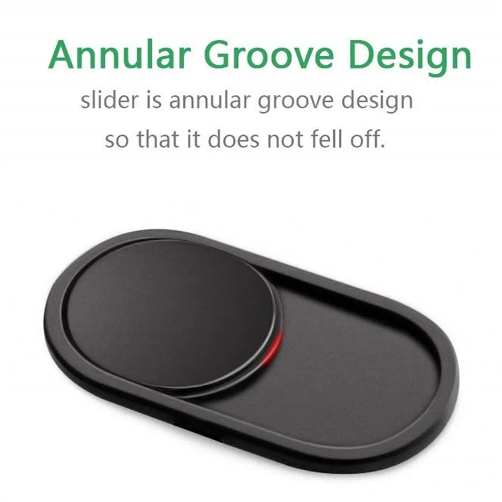 Black oval magnetic privacy cover for a webcam.