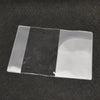A transparent PVC passport and ID holder wallet with a black stripe on a dark surface.