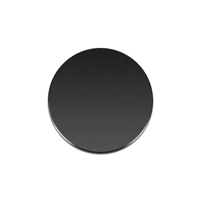 A round, matte black magnetic mount plate for phones and devices.