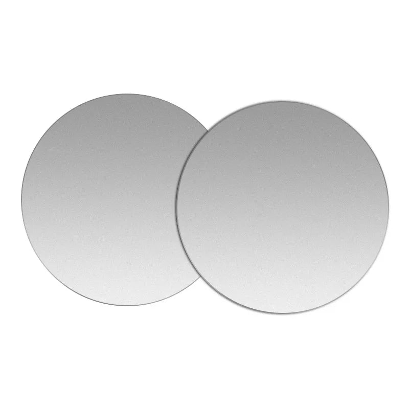 Two round, silver magnetic mount plates for phones and devices.