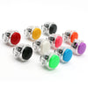 A collection of colorful arcade push button game switches in various colors like red, yellow, green, and purple.