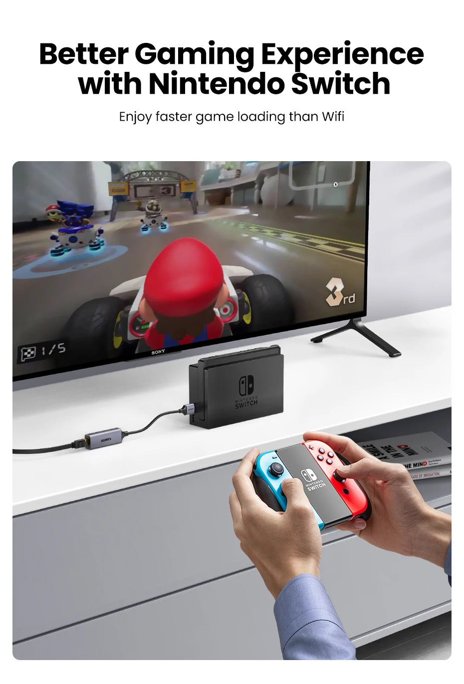 A hand connects a USB to Ethernet adapter to a Nintendo Switch console for faster game loading.