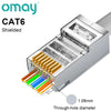 A close-up view of shielded CAT6 modular RJ45 connectors showing through-hole diameters.