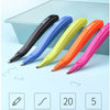 A set of five colored magnetic staple removers with push-button action displayed on a light blue surface.