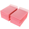 A stack of pink self-sealing bubble mailers or padded envelopes.