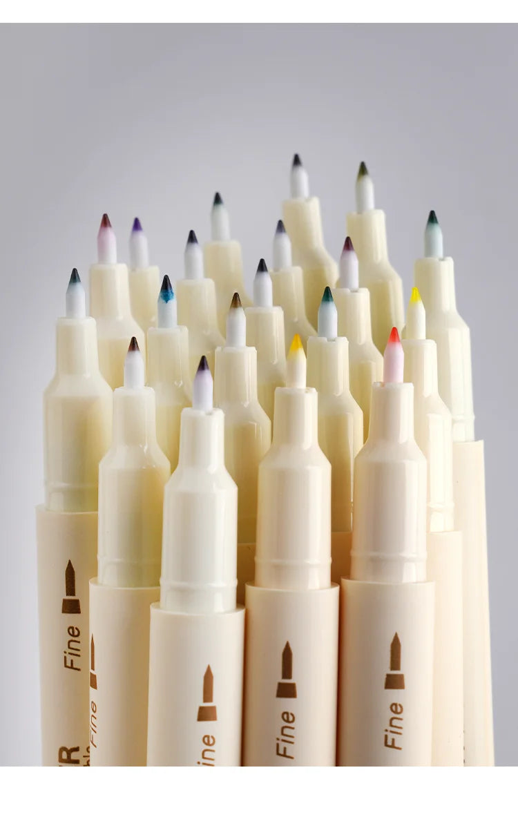 A set of three fine-tipped markers in various shades of pink and purple, arranged vertically.