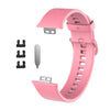 Pinkes Silikonarmband mit Schnalle und Riemen zusammen mit Ersatzteilen
