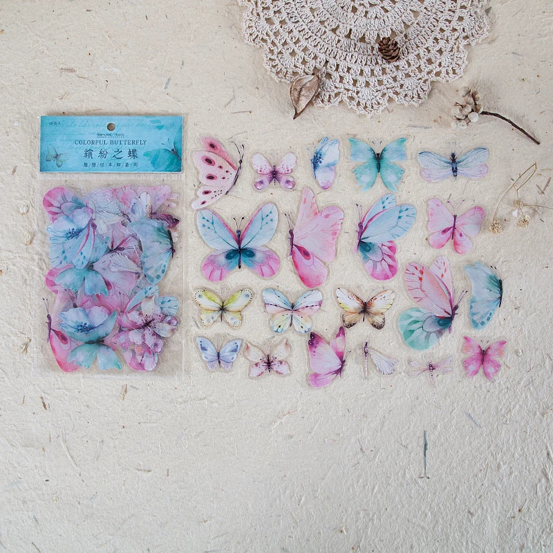 A collection of colorful butterfly wings in a clear plastic sheet for scrapbooking and journaling