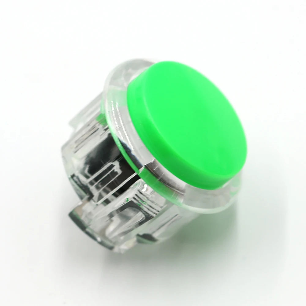 Clear plastic arcade push button game switch with a bright green top cap