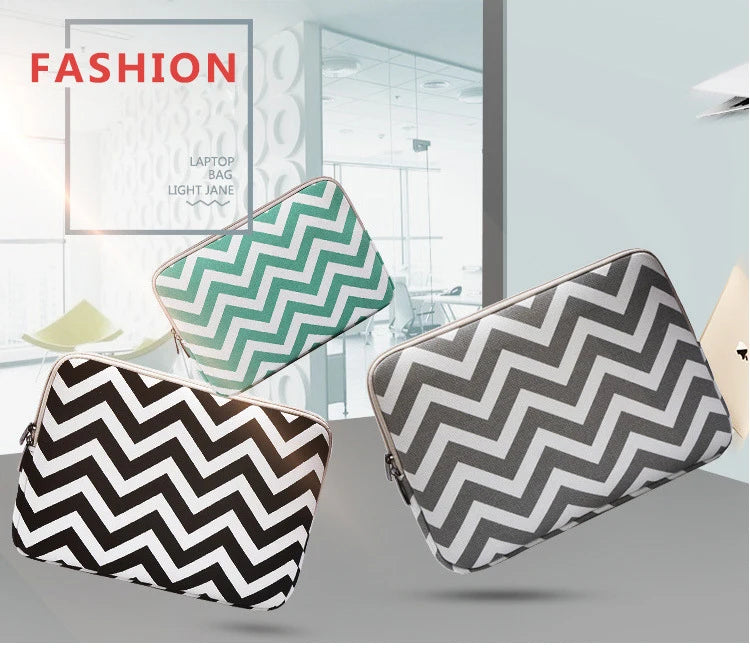 A set of three patterned canvas laptop sleeves featuring a chevron design in black and white on a light gray background.