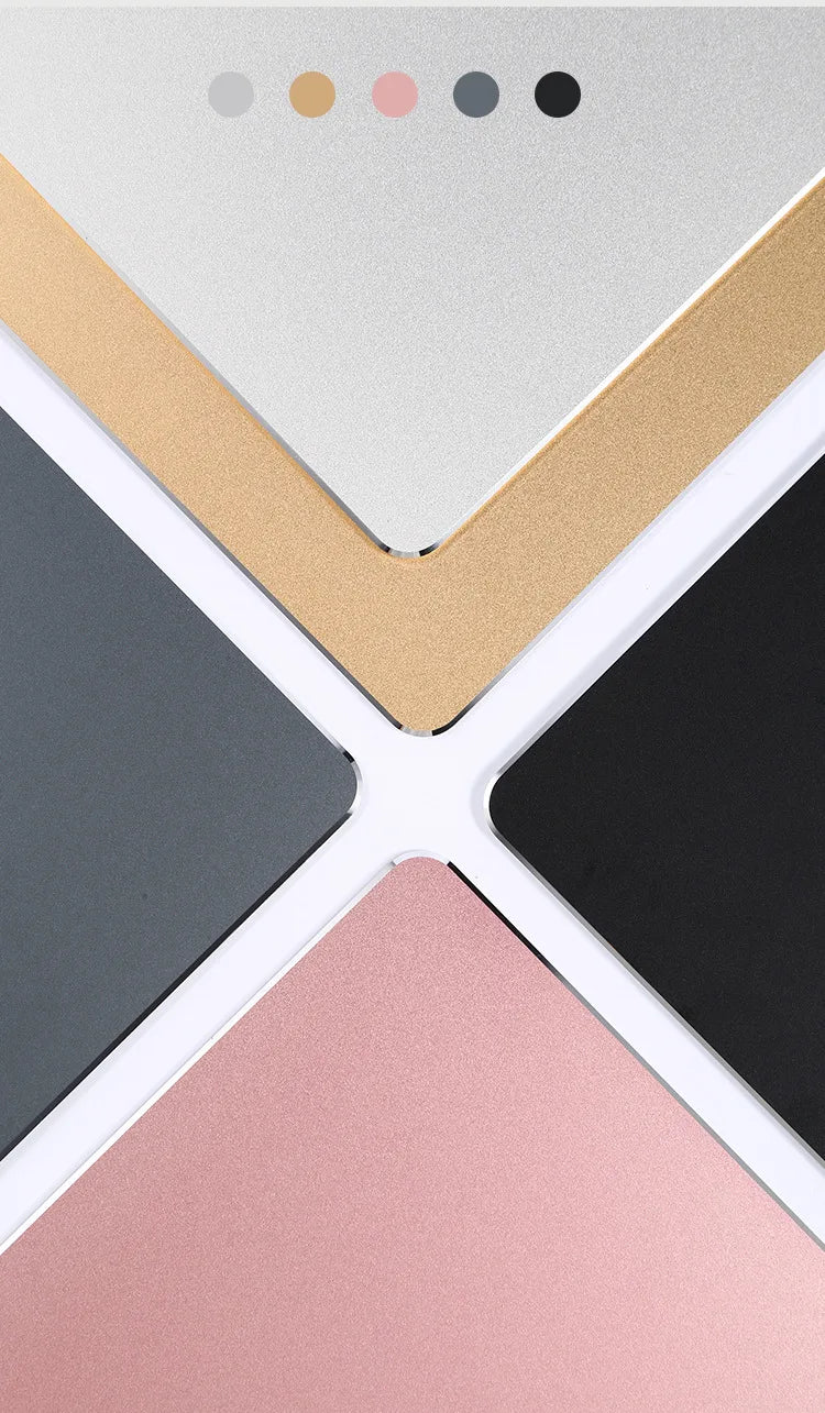 A collection of mouse pads in various colors including beige, light gray, black, and pink.