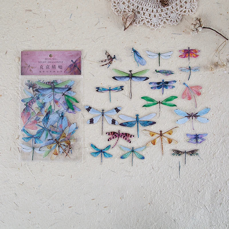 A collection of colorful butterfly wings printed on clear PET stickers for scrapbooking and journaling.