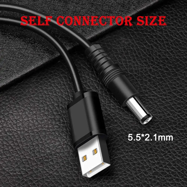 A black universal multi-connector DC charging cable with a 5.5x2.1mm connector tip shown on a dark surface.