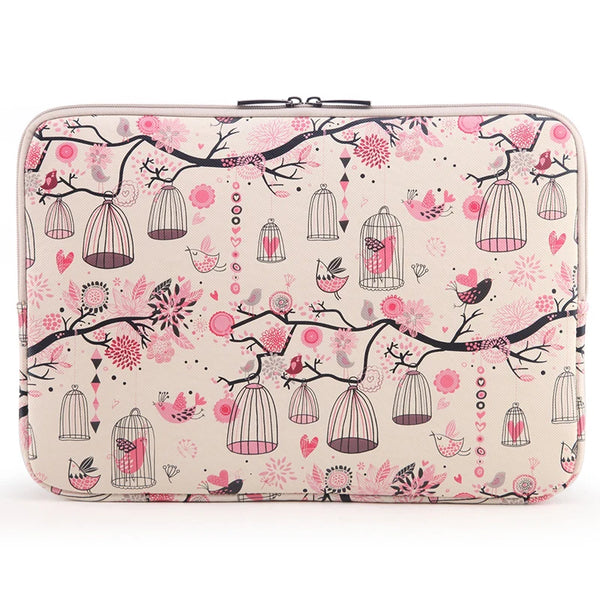 A pink floral patterned canvas laptop sleeve with a zippered closure featuring hanging birdcage designs.