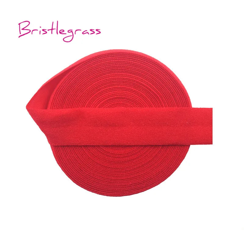 A red bristleglass hair tie with a wide elastic band shown flat.
