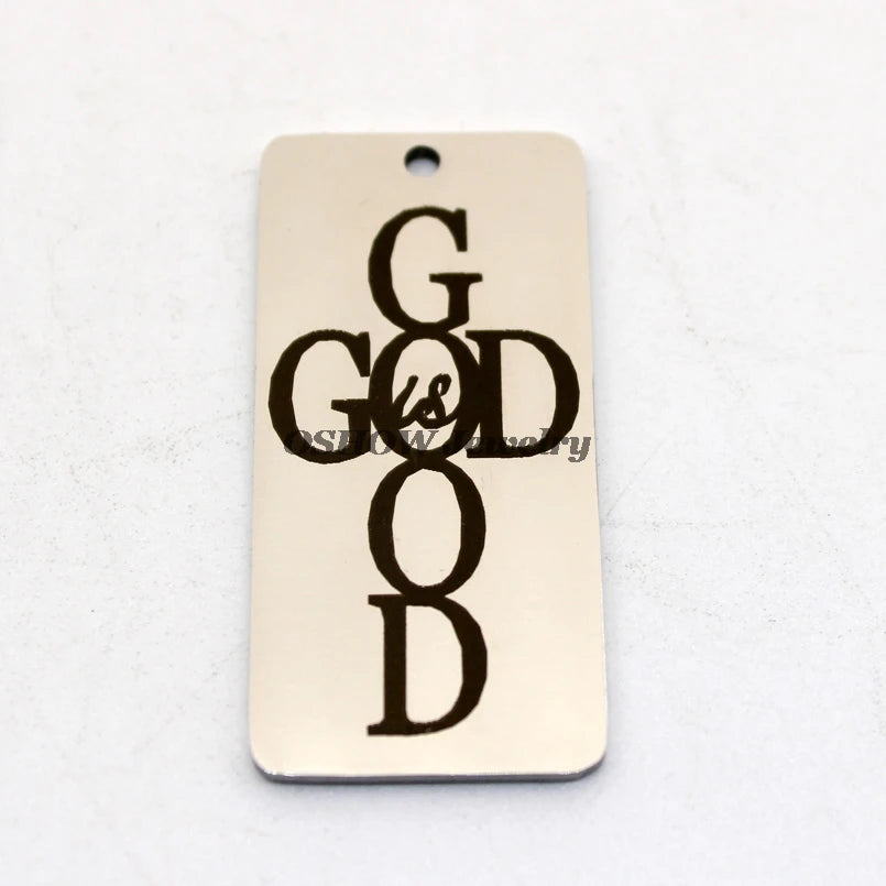 Stainless steel rectangle charm pendant with the text God Is Good in black lettering.