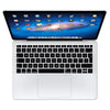 A white silicone keyboard cover for a MacBook Air or Pro laptop is shown open.