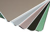 A stack of premium aluminum and PU leather mouse pads in various neutral and muted colors.