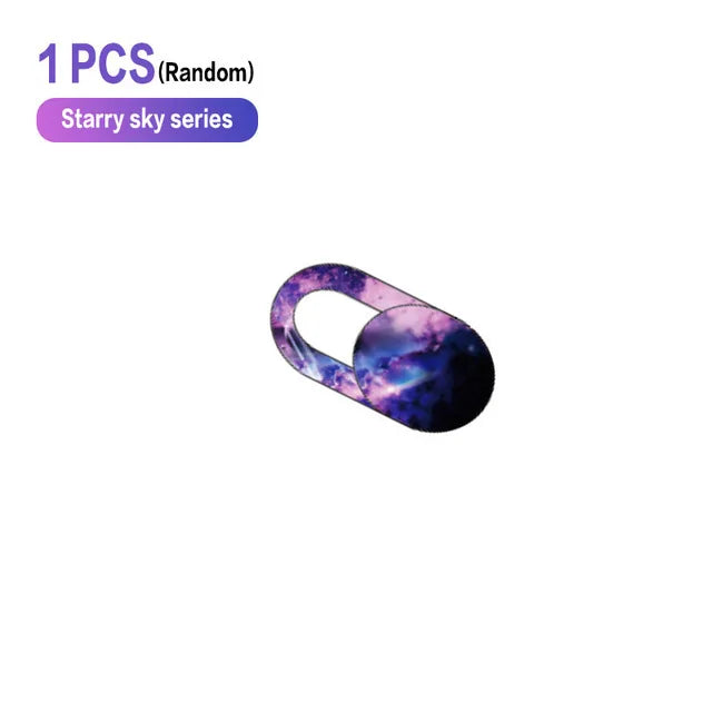 A purple and blue starry sky themed privacy webcam cover sticker for laptops.