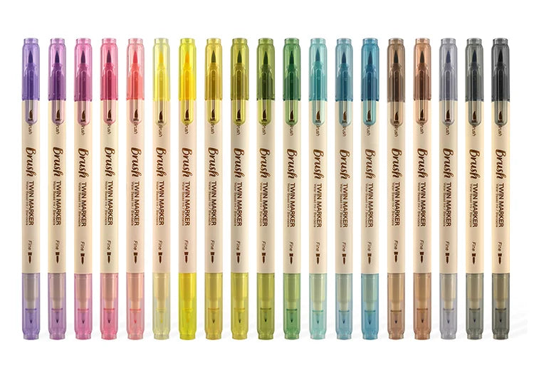 A row of 36 colored Twin Marker pens in various shades and finishes.