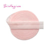A pink bristleglass elastic hair tie with a translucent pink trim.