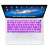 A white silicone keyboard cover for a MacBook, featuring a purple keycap layout and a display showing various icons.