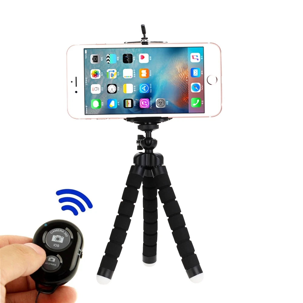 A flexible mini tripod with a phone clip is shown, featuring a smartphone mounted on top and a camera attached below.